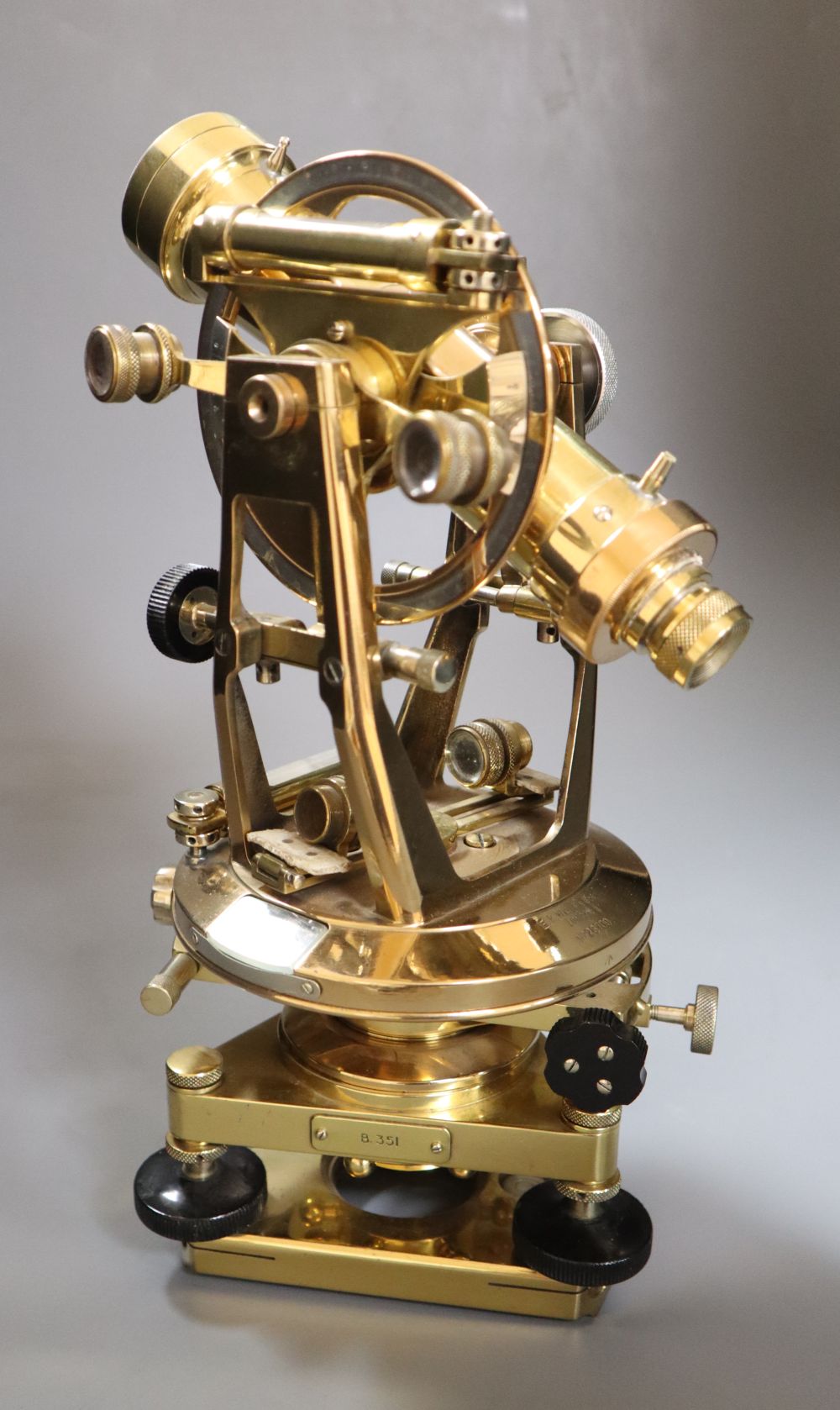 A brass theodolite, signed, Watts & Sons, London, height 32cm